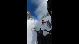Snow biker narrowly escapes collision amid sudden avalanche blocking view in Russia