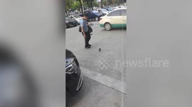 Man pecked on the head by bird - after petting its infant