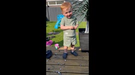 Grandpa's mock aggression delights grandson