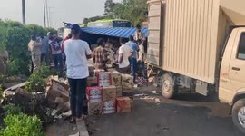 Locals seen grabbing bottles of beer when truck carrying alcohol overturns