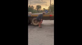 Driver rescues kitten stuck under truck in Thailand