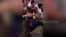 Singapore Airlines cabin crew sing 'Happy Birthday' to young passenger