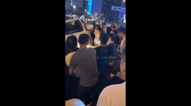 Heroic crowd lifts car to free cyclist trapped under car after collision in southern China