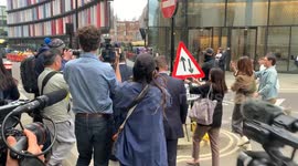 Duo accused of spying on dissidents living UK for Hong Kong leave court
