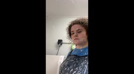 Samoyed showers groomer with shampoo.