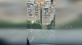 High-rise flats uninhabitable after windows mysteriously explode