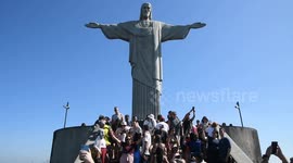 Brazil: A crowd of people looks at Cristo