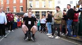 Wirksworth wheelbarrow pub race between six pubs, each contestant has to drink 1/2 pint of beer at each pub & swap between pusher & rider. 2K version