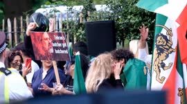 Iranian monarchists celebrate President Raisi's death opposite London embassy