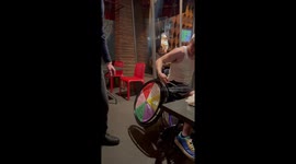 Friend turns wheelchair into fortune wheel for hilarious moment