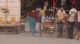 Delhi Faces Severe Water Crisis As Temperatures Soar,water tankers distributing water
