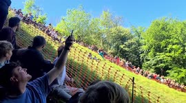 Hilarious footage shows cheese rolling contestants tumbling in slow-motion