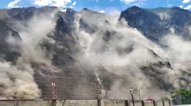 Massive clouds of dust billow as mountainside collapses due to earthquake in China