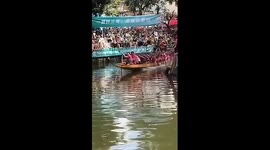 Dragon boat charges around corner