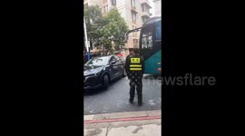 Bus forcibly pushes car aside amid U-turn dispute in China
