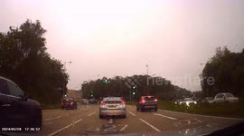Close call as car swerves into lane in front of another car, causing hard braking/stop!