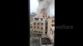 Heroic firefighters rescue mum and daughter from burning flat in China