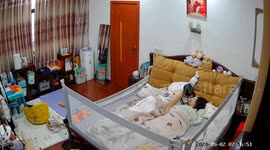 Baby mimics dad's loving morning kisses to mom in Eastern China
