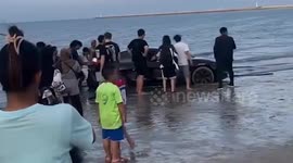 Show-off vlogger sparks outrage driving Tesla car along beach in Thailand