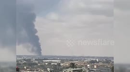 Smoke billows after fire breaks out at aid facilities in east Rafah following Israeli raids