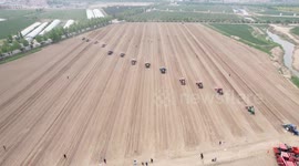China: Farmers Drive Machinery to Sow Corn in Binzhou