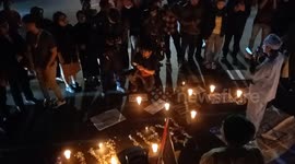 People pray and light candles as a form of solidarity and support for the Palestinian people in Bandung.