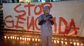 People pray and light candles as a form of solidarity and support for the Palestinian people in Bandung.