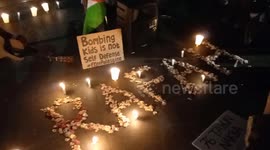 People pray and light candles as a form of solidarity and support for the Palestinian people in Bandung.
