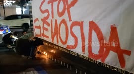 People pray and light candles as a form of solidarity and support for the Palestinian people in Bandung.