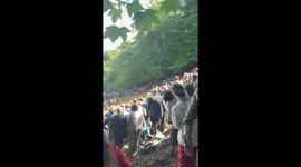 Crowd reacts as man defaces TRUMP 2024 flag at Gloucester Cheese Rolling contest