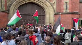 Newcastle University students gather at the front door of the Armstrong Building