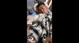 Clingy pooch cuddles with owner in bed and refuses to leave