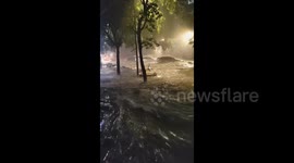 Delivery rider rescued after being swept away by floodwaters in China