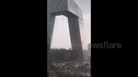 Sudden storm leaves window cleaners hanging from ropes on Chinese skyscraper
