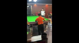 Youngster leaps onto snooker table to position balls