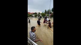 Locals cast out nets in hope of catching fish in waist-deep floodwater in east India