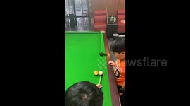 China: A Precise Shot in Pool