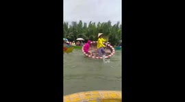 Funny Vietnam party basket boat dancing on water palm jungle