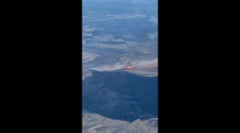 View from plane of huge wildfire burning through California forcing locals to evacuate
