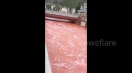 Abnormally red river in China turns out non-toxic after colour sparked concerns