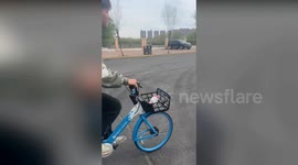 Student rides to university without a saddle on bike