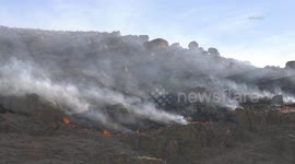 USA: The strong wind fanning the flames is clearly heard
