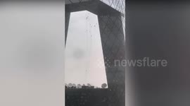 Sudden storm leaves window cleaners hanging from ropes on Chinese skyscraper