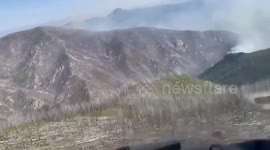 USA: Firefighters Make Progress Battling Blaze as Weather Provides Assistance