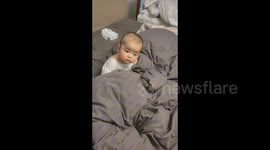 China: Hungry Baby's Adorable Wait