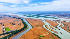 China: Villagers Harvest Mature Wheat in A Field in Huai'an