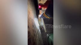 Resident stuck in 30cm wide crevice while retrieving dropped phone