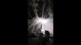 Mesmerizing footage shows thrilling nighttime bike ride through snow-covered woods
