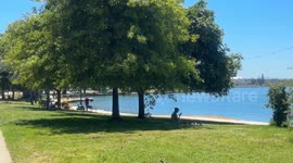 USA: People in Oakland resting in the shade