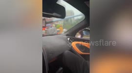 Supercar driver uses glass cleaner on windshield when wipers fail during storm
